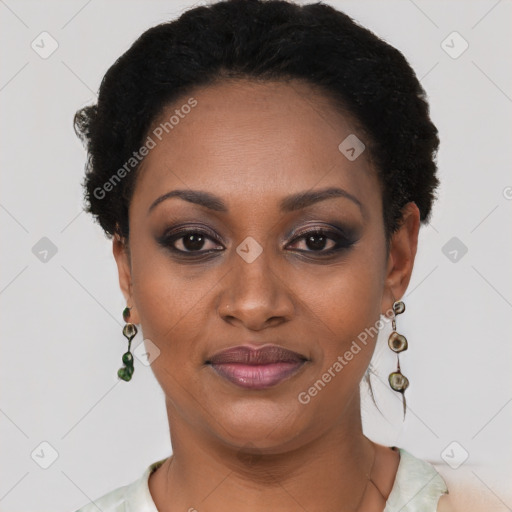 Joyful black young-adult female with short  black hair and brown eyes