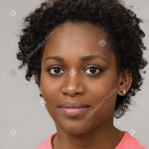 Joyful black young-adult female with medium  black hair and brown eyes