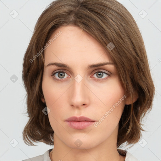 Neutral white young-adult female with medium  brown hair and green eyes