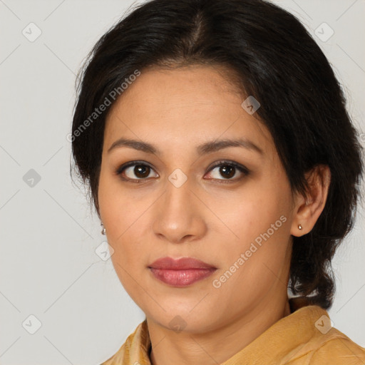 Joyful latino young-adult female with medium  brown hair and brown eyes