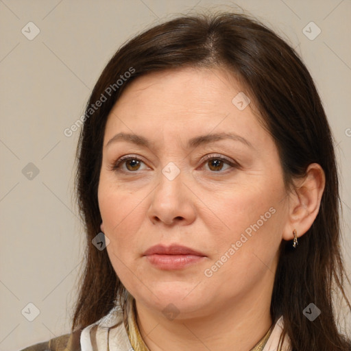 Joyful white adult female with medium  brown hair and brown eyes