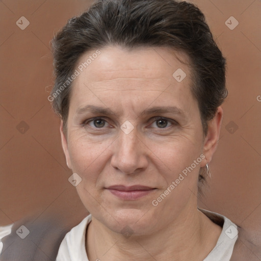 Joyful white adult female with short  brown hair and brown eyes