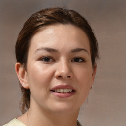 Joyful white young-adult female with medium  brown hair and brown eyes