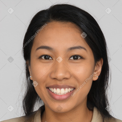 Joyful latino young-adult female with long  black hair and brown eyes