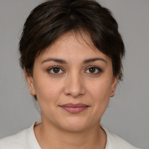 Joyful white young-adult female with medium  brown hair and brown eyes