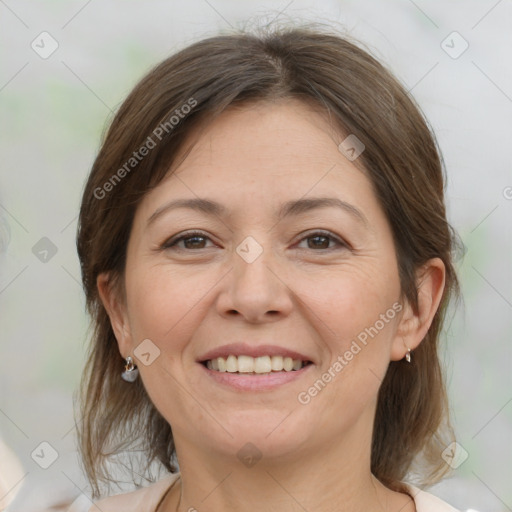 Joyful white adult female with medium  brown hair and brown eyes