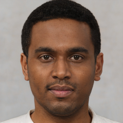Neutral latino young-adult male with short  brown hair and brown eyes