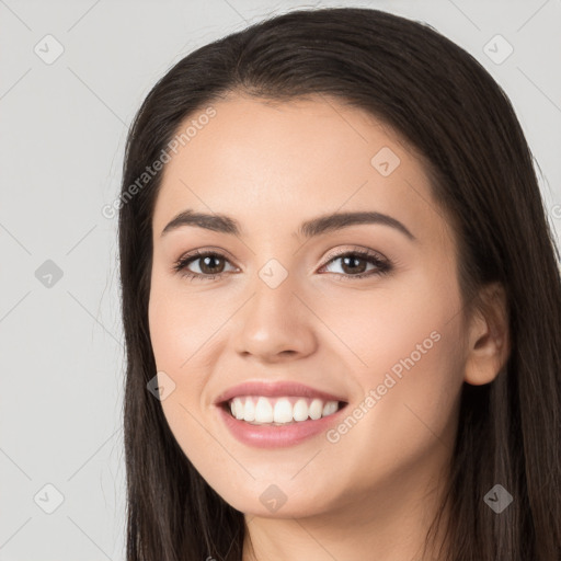 Joyful white young-adult female with long  black hair and brown eyes