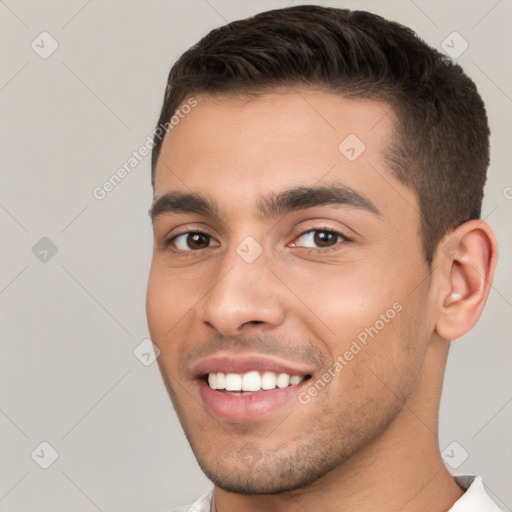 Joyful white young-adult male with short  brown hair and brown eyes