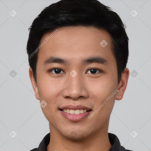 Joyful asian young-adult male with short  black hair and brown eyes