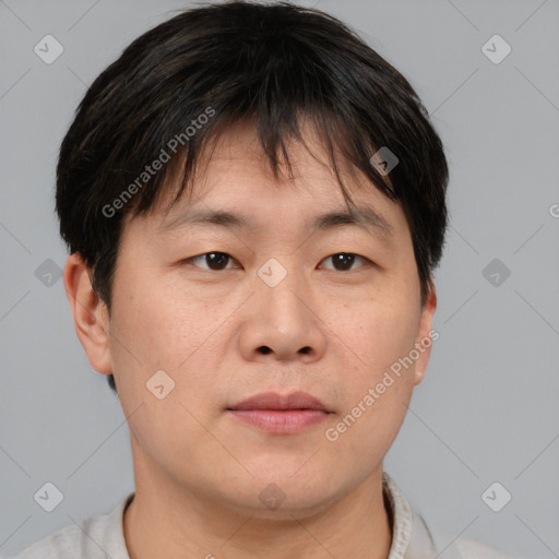 Neutral asian young-adult male with short  brown hair and brown eyes