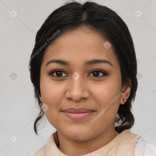 Joyful latino young-adult female with medium  brown hair and brown eyes