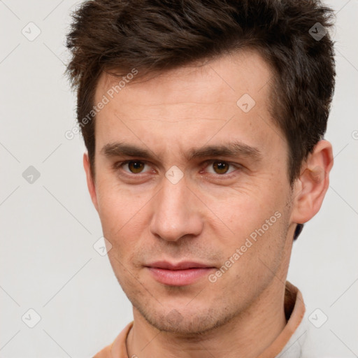 Neutral white young-adult male with short  brown hair and brown eyes