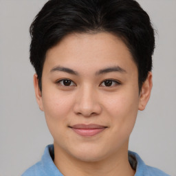 Joyful asian young-adult female with short  brown hair and brown eyes