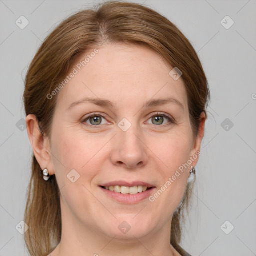 Joyful white adult female with medium  brown hair and blue eyes