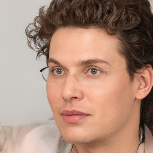 Joyful white young-adult male with medium  brown hair and brown eyes