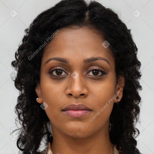 Joyful black young-adult female with long  brown hair and brown eyes