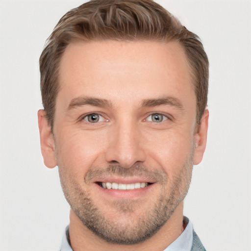 Joyful white young-adult male with short  brown hair and brown eyes