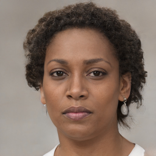 Neutral black young-adult female with short  brown hair and brown eyes