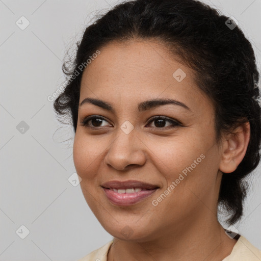 Joyful latino young-adult female with medium  brown hair and brown eyes