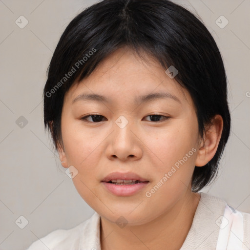 Joyful asian young-adult female with medium  black hair and brown eyes