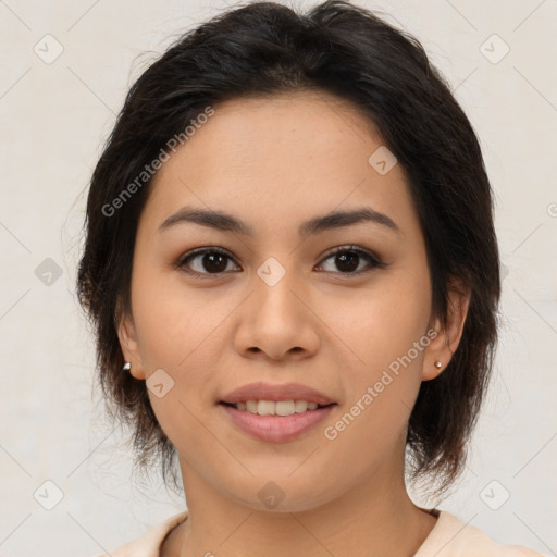 Joyful latino young-adult female with medium  brown hair and brown eyes