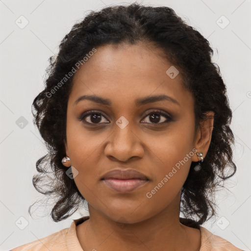 Joyful black young-adult female with long  brown hair and brown eyes