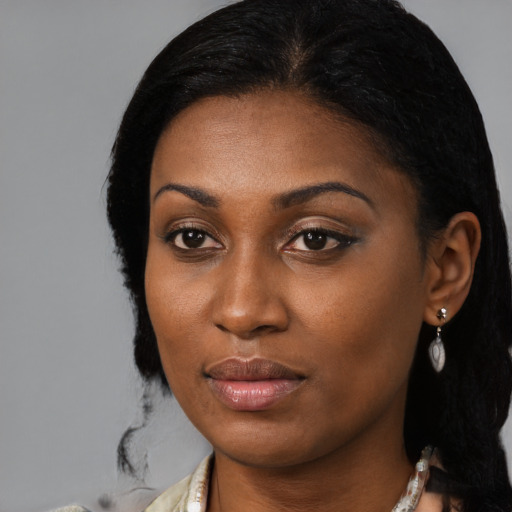 Neutral black young-adult female with medium  black hair and brown eyes
