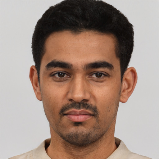 Neutral latino young-adult male with short  black hair and brown eyes
