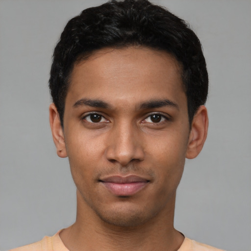 Neutral latino young-adult male with short  black hair and brown eyes