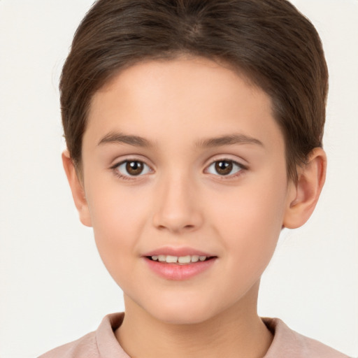 Joyful white child female with short  brown hair and brown eyes