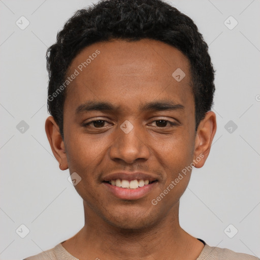 Joyful black young-adult male with short  black hair and brown eyes