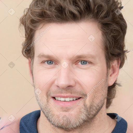 Joyful white adult male with short  brown hair and grey eyes