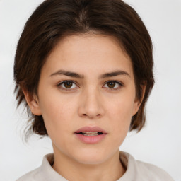 Neutral white young-adult female with medium  brown hair and brown eyes