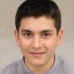 Joyful white child male with short  brown hair and brown eyes