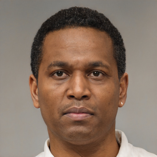 Neutral latino adult male with short  black hair and brown eyes