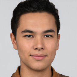 Joyful latino young-adult male with short  brown hair and brown eyes