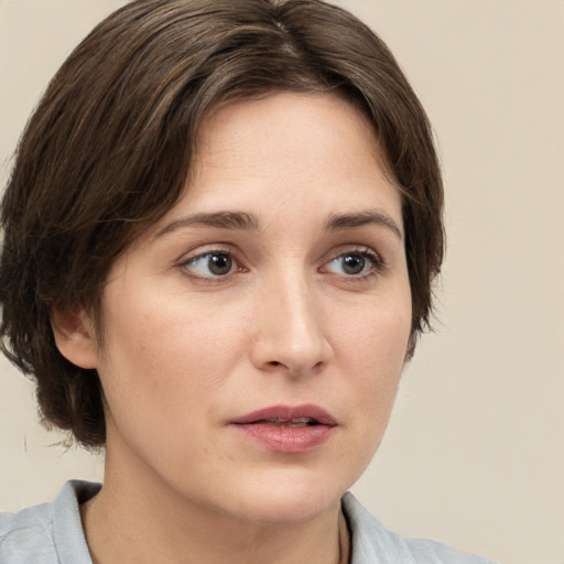 Neutral white young-adult female with medium  brown hair and grey eyes