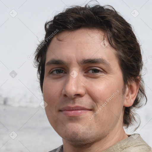 Joyful white young-adult male with medium  brown hair and brown eyes