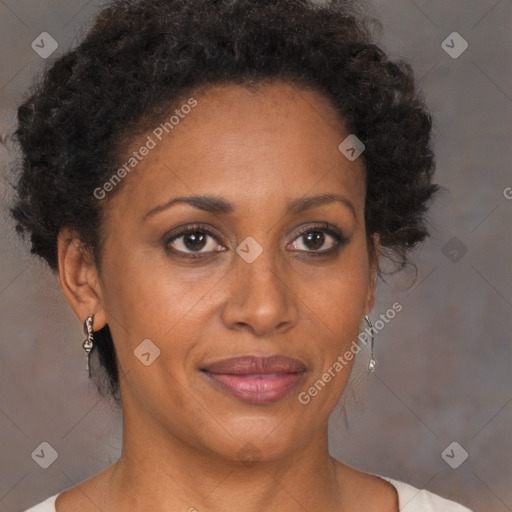 Joyful black adult female with short  brown hair and brown eyes