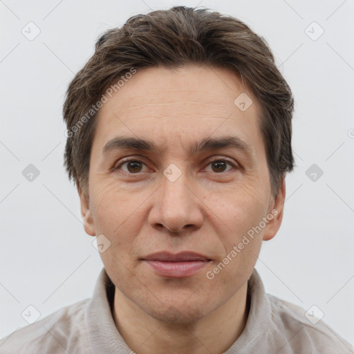 Joyful white adult male with short  brown hair and brown eyes