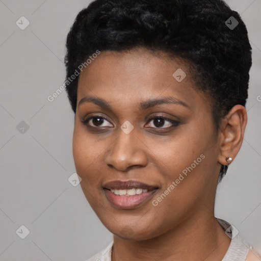 Joyful black young-adult female with short  black hair and brown eyes