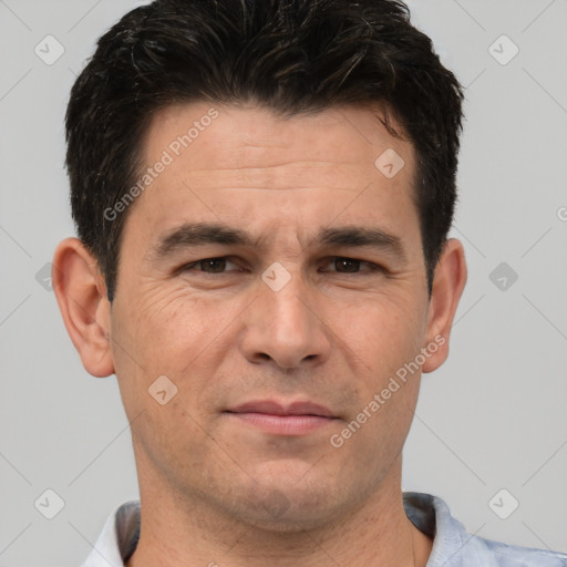 Joyful white adult male with short  brown hair and brown eyes