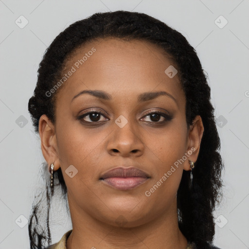 Joyful black young-adult female with long  brown hair and brown eyes
