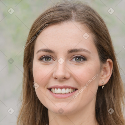 Joyful white young-adult female with long  brown hair and green eyes