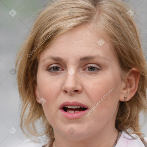 Joyful white young-adult female with medium  brown hair and blue eyes