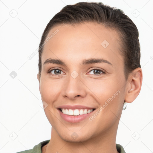 Joyful white young-adult female with short  brown hair and brown eyes