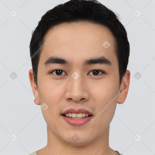 Joyful asian young-adult male with short  black hair and brown eyes