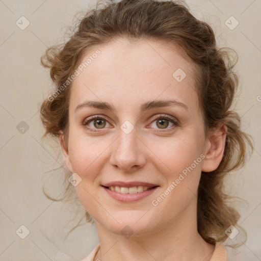 Joyful white young-adult female with medium  brown hair and green eyes