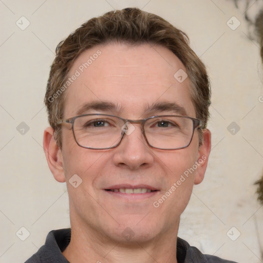 Joyful white adult male with short  brown hair and grey eyes